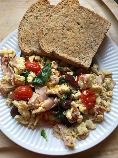 Scrambled eggs with ham, tomato, greens, kalmata olives end product Aug 13, 2017